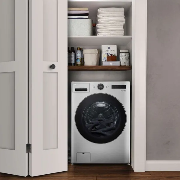 The LG WM6998HVA washer dryer combo in a closet